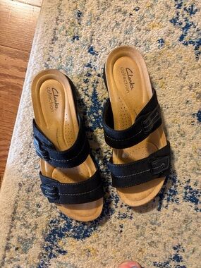 Clarks Black Slide Sandals with Tan Footbed